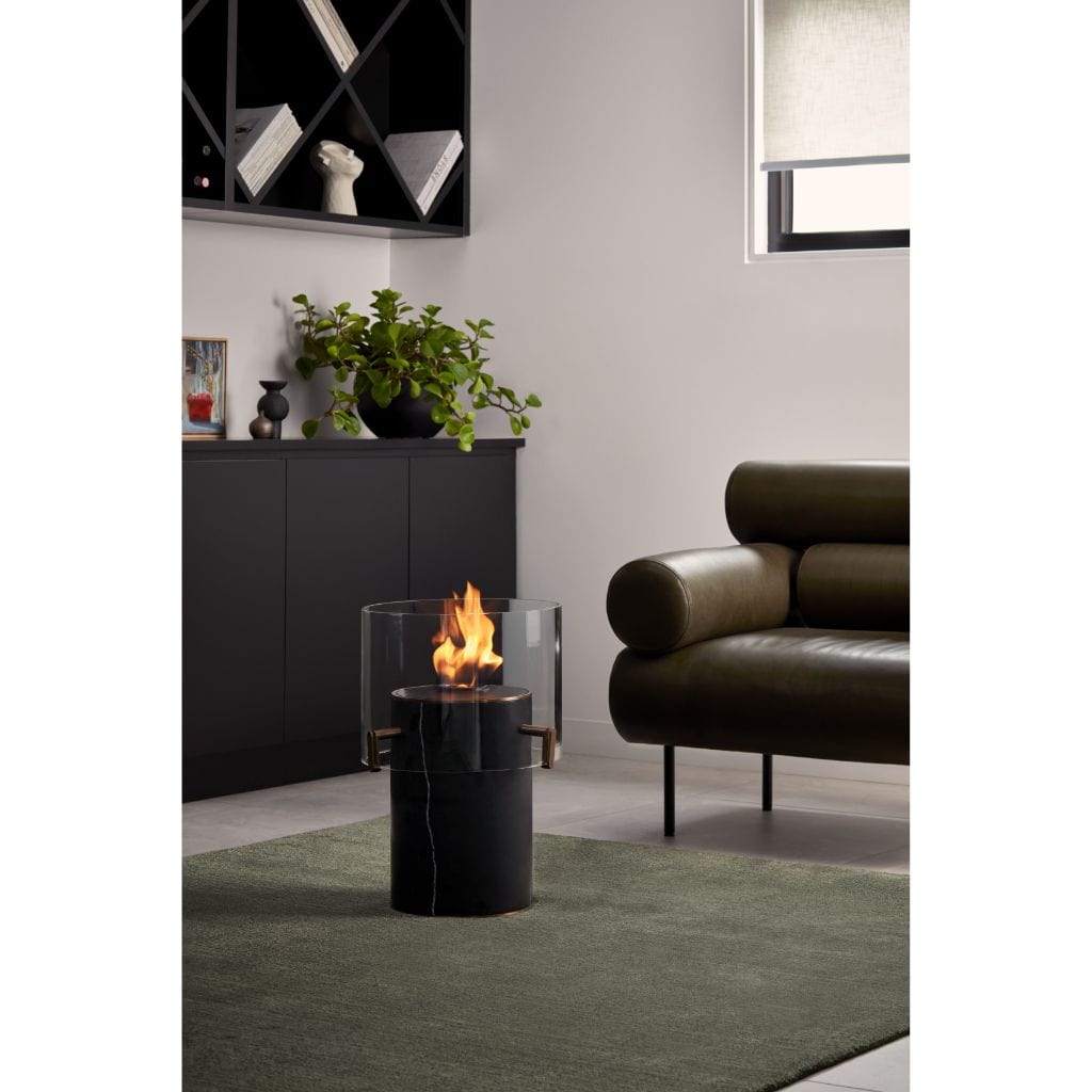 Sitting room with marble fireplace, pair of black leather button