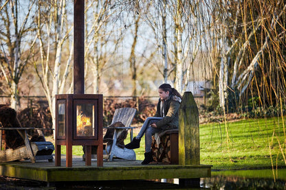 RB73 Quaruba XXL MOBILE 4-Sided Glass Warm Brown CorTen Steel Wood-Burning Outdoor Fireplace
