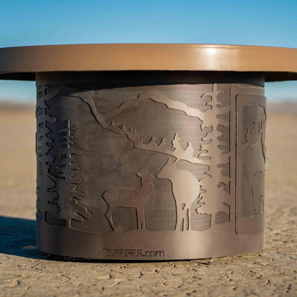 The Outdoor Plus 46" Outback Deer Country GFRC Top and Powdered Steel Base Round Liquid Propane Fire Table - 12V Electronic